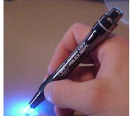 hand holding a light pen